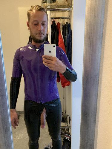 Purple latex and black leggins fetish slave Benjamin fiegl.jpg