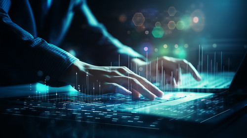 Close up of male hands using laptop keyboard at desk with digital business chart hologram on blurry .jpg