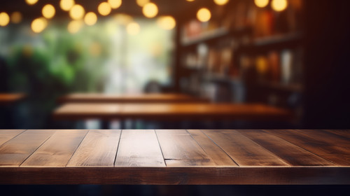 Blurred coffee shop and restaurant interior background with empty wooden table Use for products disp.jpg