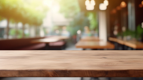 Blurred coffee shop and restaurant interior background with empty wooden table Use for products disp.jpg