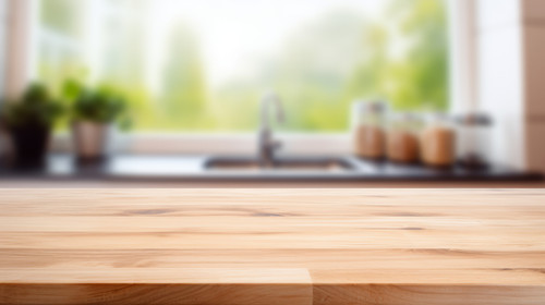 Wooden table on blurred kitchen bench background Empty wooden table and blurred kitchen background c.jpg