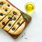 Traditional Italian Focaccia with  black olives and rosemary - homemade flat bread focaccia