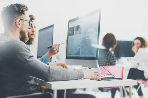 depositphotos 106900274 stock photo coworking process designers team work.webp