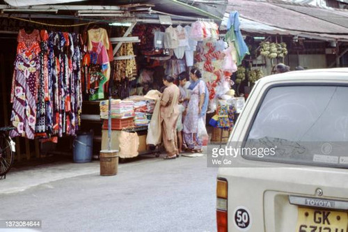 Singapore, December 29, 1989 - A clothes and cloths stall in Jalan Besar, an old district of Singapo.jpg