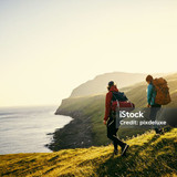 Shot of a young couple hiking through the mountains