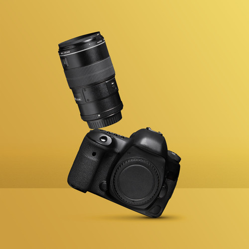 photo camera balancing with yellow background.jpg