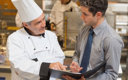 Waiter and chef discussing the menu.jpg