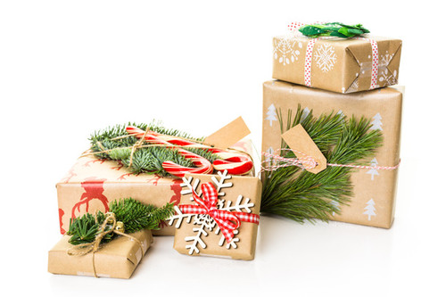 Christmas gifts wrapped in brown paper with red ribbons..jpg