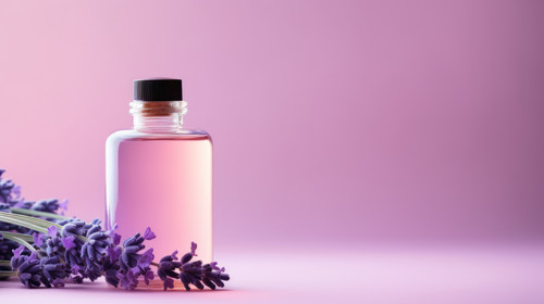 A bottle of lavender essential oil lavender flowers on a purple podium Cosmetic essential oil for bo.jpg