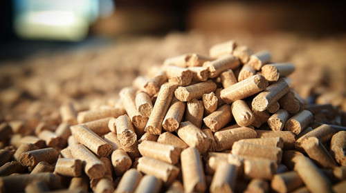 A pile of organic biofuel wooden pellets made from compacted sawdust and byproduct of woodworking op.jpg