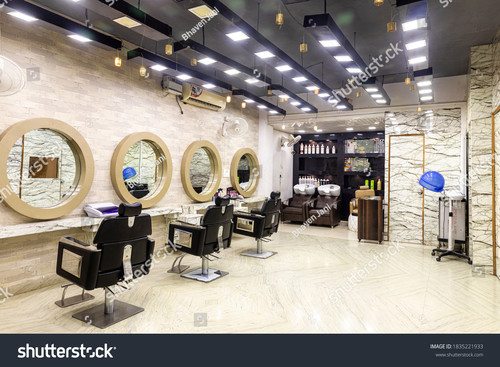 stock photo view inside of a modern salon showing mirrors and sitting arrangement beauty parlour int
