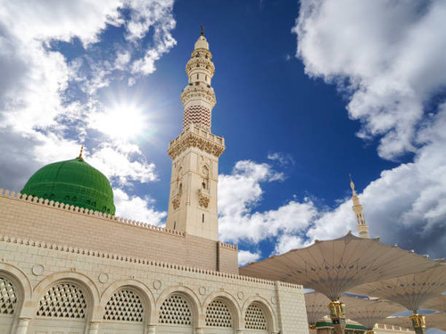 view of cloudy blue sky at nabawi mosque or prophet mosque in medina saudi arabia.jpg