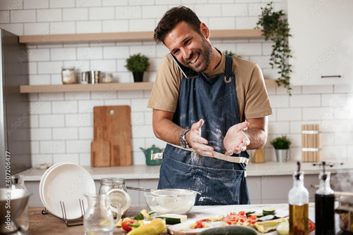 random man cooking talking phone.jpg