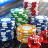 Virtual casino. Online gambling. Laptop with dice and chips.