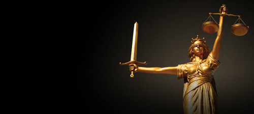 Goddess Themis of justice with a sword and scales in her hands..jpg