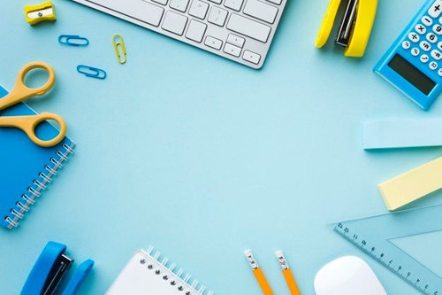 Free Photo Copy space surrounded by office supplies.jpg