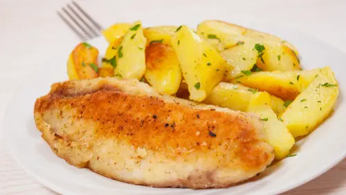 baked fish and potatoes with rosemary and garlic.webp