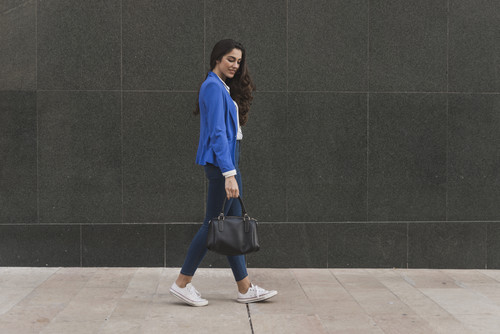 pensive employee walking down street.jpg