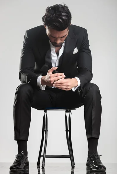 depositphotos 54266549 stock photo man in tuxedo looking down (1).webp