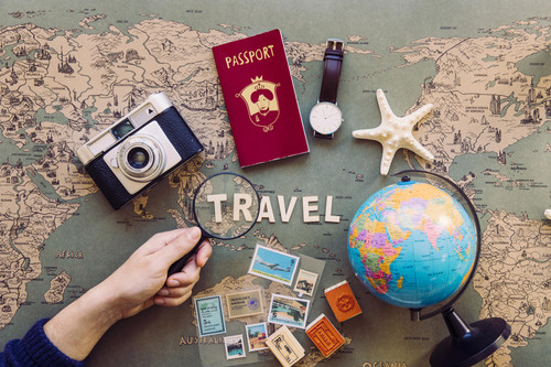 crop hand with magnifier travel writing min.jpg