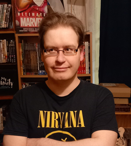 Me infront of shelf.jpg