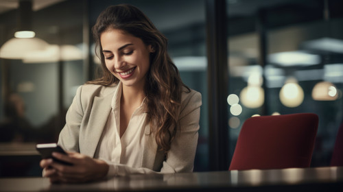 People with passion make things happen Shot of a young businesswoman using a mobile phone at her des.jpg