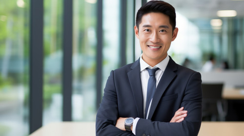 Portrait business and asian man in studio with arms crossed for professional style of broker financi.jpg
