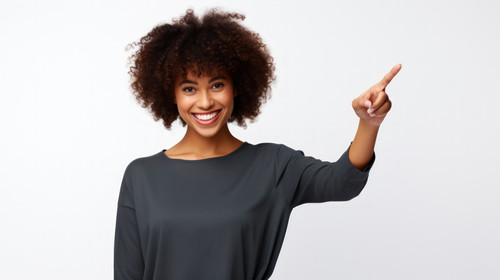 Pointing portrait and black woman with a smile promotion and presentation against a white studio bac.jpg
