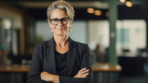 Portrait arms crossed and smile of business woman in office with pride for career and job Ceo glasse.jpg