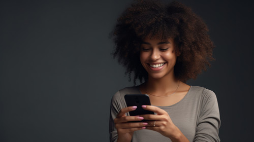 Phone texting and happy black woman in studio for social media app or communication on grey backgrou.jpg
