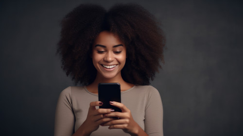 Phone texting and happy black woman in studio for social media app or communication on grey backgrou.jpg