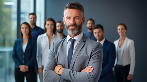 Portrait collaboration and management with a business man and his team standing in the office togeth.jpg