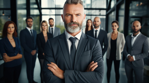 Portrait collaboration and management with a business man and his team standing in the office togeth.jpg