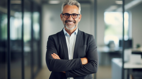 Portrait confident and arms crossed with a business man in his office looking happy about his compan.jpg