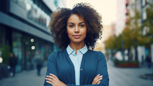 Portrait happy and city with a business black woman standing arms crossed outdoor for management Lea.jpg
