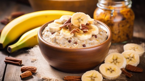 Healthy overnight oatmeal Bircher muesli served with bananas brown sugar pecan nuts and maple syrup .jpg