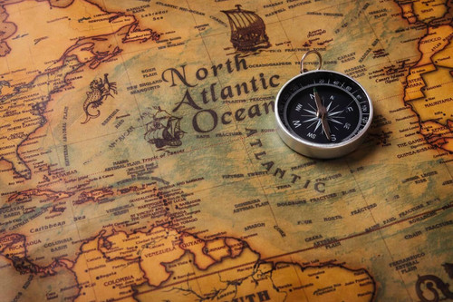 155923066 old compass discovery on vintage paper antique world map background retro style cartograph.jpg