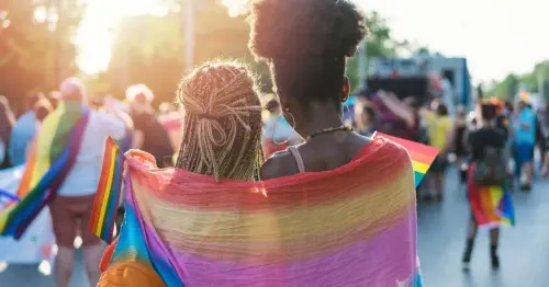 best gay pride festivals 2023 couple sunset some.webp