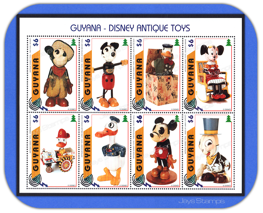 1996  Guyana DISNEY ANTIQUE TOYS  Souvenir Sheet of 8 MNH attached Stamps #3098