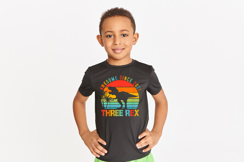 Studio shot of handsome athletic dark skinned little boy posing isolated in black t-shirt keeping ha.jpg