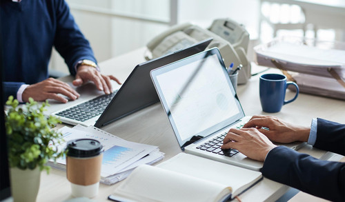 side view cropped unrecognizable business people working common desk.jpg