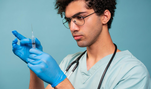 side view doctor holding injection.jpg