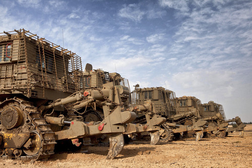 Israeli military armored bulldozers adjacent to the Gaza Strip.jpg