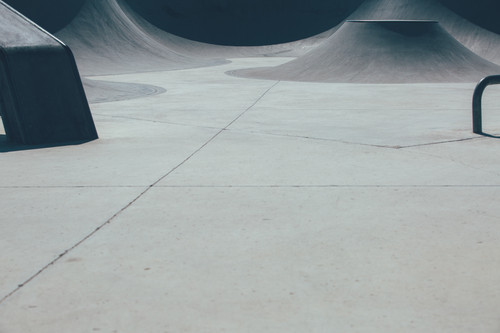 Detail of the view of a ramp used as obstacle to make tricks in an empty urban skate park. Useful as.jpg