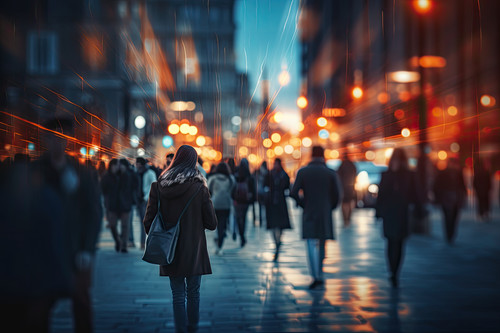 Woman walking on the street at night in the city. Blurred background, Crowd of people walking in the.jpg