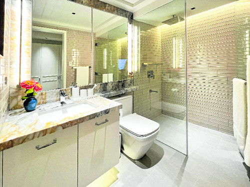 Bask in the elegance of modern living with this en suite bathroom, ensuring a luxurious experience f.1
