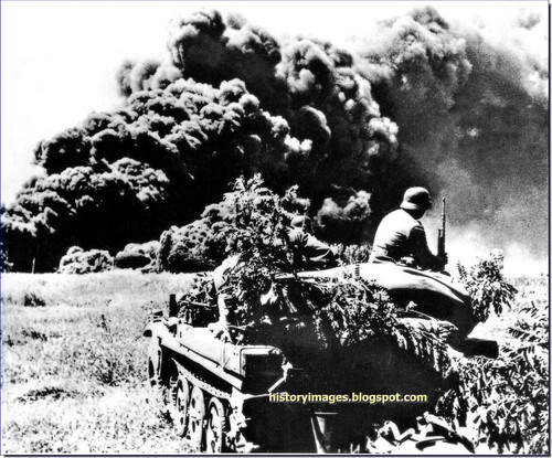 germans attack caucasus 1941 1943 german soldiers watch burning oil wlls maykop 1942.jpg
