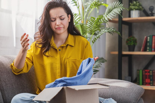 unhappy young mixed race girl with cardboard box dissatisfied with wrong item delivery 650366 1837.jpg
