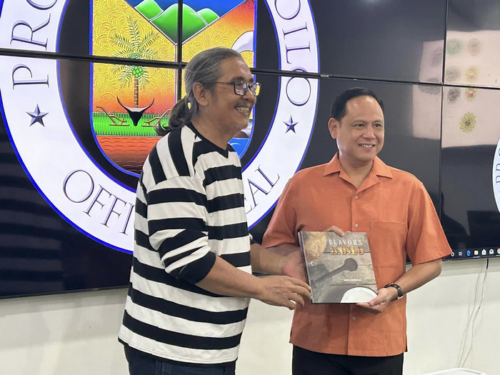 Author Chef Rafael "Tibong"Jardeleza, Jr. presents the book Flavors of Iloilo to Iloilo Province Governor Arthur Defensor, Jr.