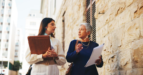 lawyer team talking with business people city case files trial assessment attorney brief plead agree.jpg